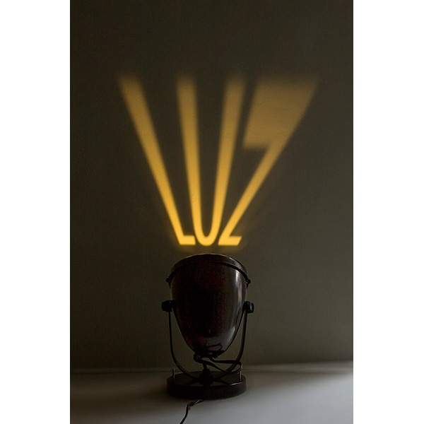 Regina Silveira, Luminarialuz, 2017, luminária com recorte metálico, 17,5cm x 13,5 x 13,5 cm, edição de 92 + 10 P.A